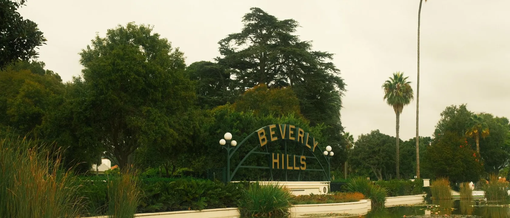 The Beverly Hills sign in a landscaped park in Beverly Hills, CA