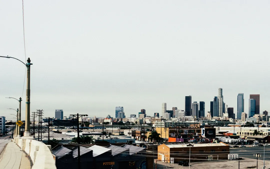 A West Los Angeles street with the downtown skyline in the distance